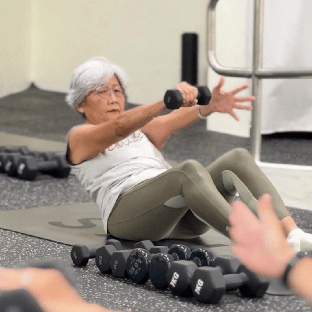 Training in a Strength class at SALT Fitness, with dumbbells available for each for progressive overload